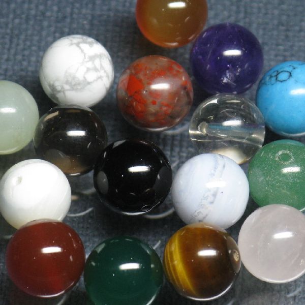10mm Rpund beads made of of Jasper, Agate, Carnelian, Onyx, Tiger Eye, Aventurine, Rose Quartz, Turquoise, Mother of Pearl, Amethyst Crystal, Serpentine, Howlite, and others.. 